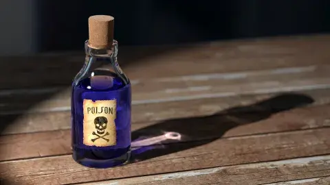 A color photo of a glass bottle filled with purple liquid and the poison symbol on the front, Image by qimono from Pixabay