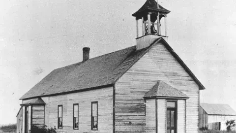 A school house in black and white.