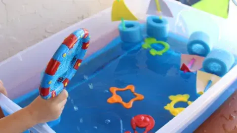 Bin with water and sensory toys