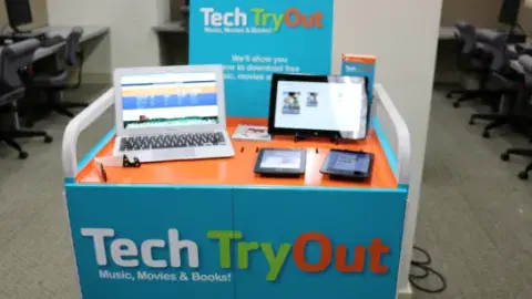 blue computer cart with a tablet and 