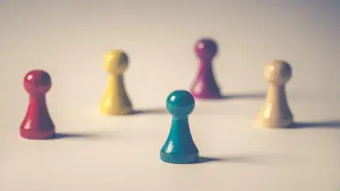 A color phot of red, yellow and green game pieces, Image by Ylanite Koppens from Pixabay