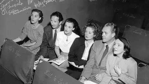 5 very engaged regular attendees at the Turnabout Theatre in the 1940s