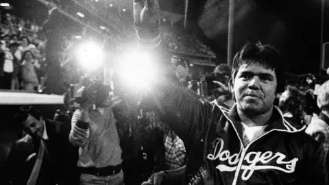 Dodger pitcher Fernando Valenzuela waves to his fans
