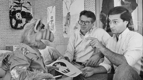 Writer and co-creator Tom Patchett, left, and voice actor Paul Fusco, right, are confronted with last-minute script changes from star ALF.