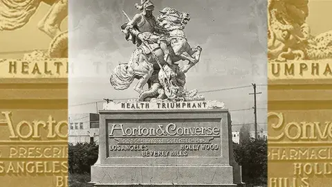 A roadside statue advertising Horton & Converse prescription pharmacists.