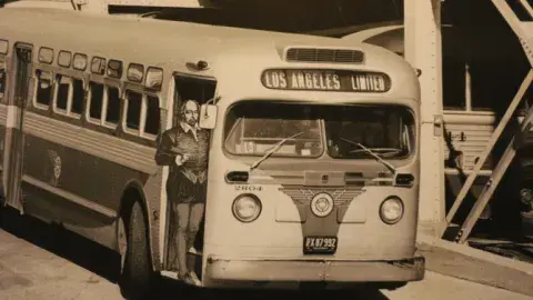 Historic Los Angeles bus with cut-out of Shakespeare hanging out of the door