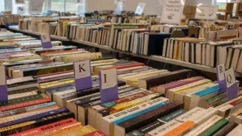 Assortment of books organized for a book sale