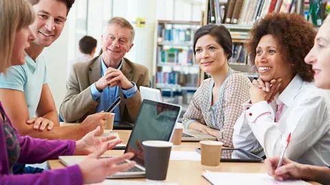 People discussing a book