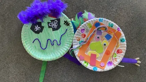 Handmade monster crafts made out of paper plates and assorted craft items