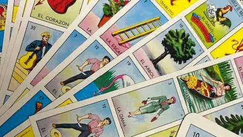 Loteria boards fanned out across a table. 