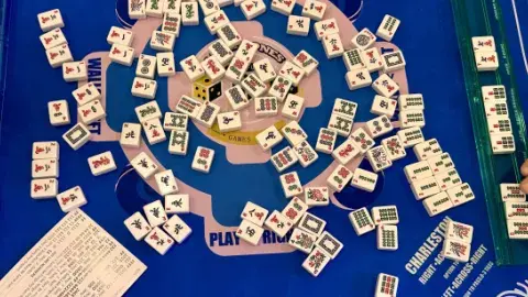 MahJong tiles being played mid-game.