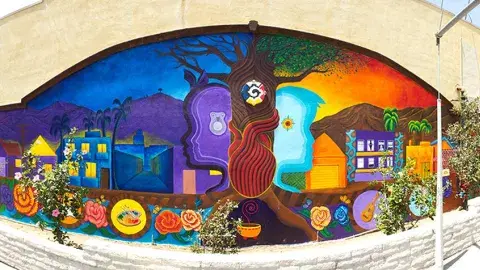 A mural depicting the tree of life, the masculine/feminine generating principles of the world, and the wholeness of self, community, earth, and spirit.