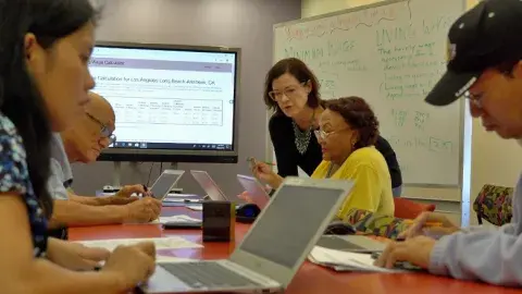 Adult learners learning in a class room setting.