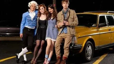 humans standing next to vehicle