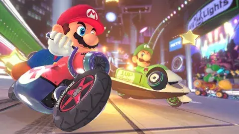 Video game character Mario on a red motorcycle. 