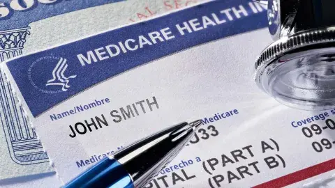 Medicare card with pen