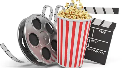 Movie reel with red and white popcorn bucket and clap board