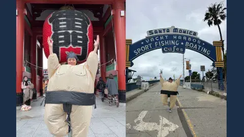 Woman in Sumo costume in front of two landmarks. 
