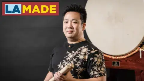 person standing in front of a drum. the la made logo in the corner.