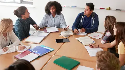 Group of teens sitting at a table