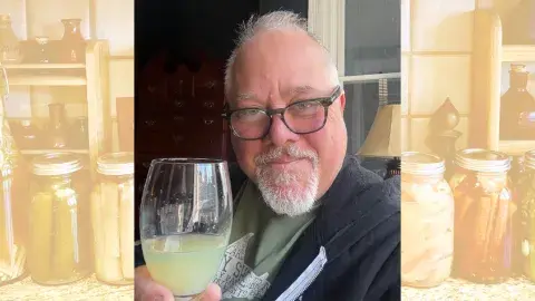 Ken Albala holding a wine glass