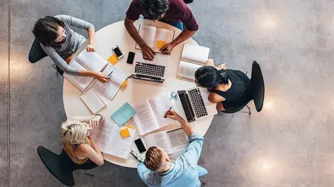 top view of students sitting around a table