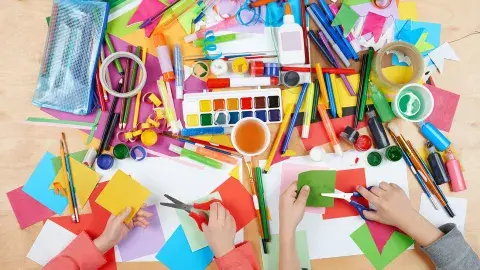 Kids crafting with craft supplies