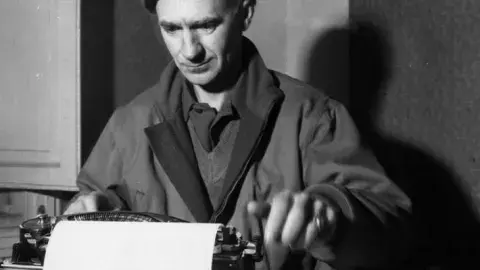 Ernie Pyle at a typewriter