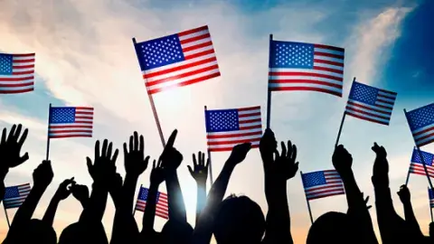 People holding up flag