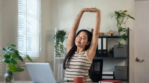 stretching at the desk