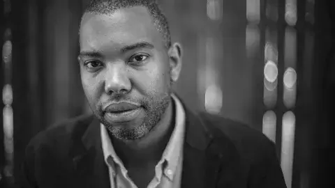 Black and white headshot of author Ta-Nehisi Coates