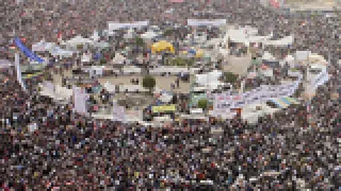 enoumous gathering of people in a city square as seen from above