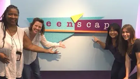 PR Speakers in front of the Teen'sScape sign