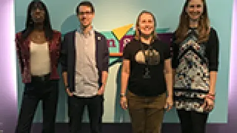 4 librarians in front of the Teenscape sign