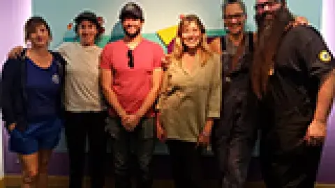 6 artisans in front of the Teenscape sign