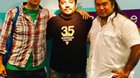 three middle aged dudes standing in front of the teen'scape sign