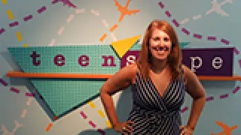 Wende Crowley in front of the teen'scape sign