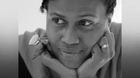 Poet Janice Harrington with her head in her hands